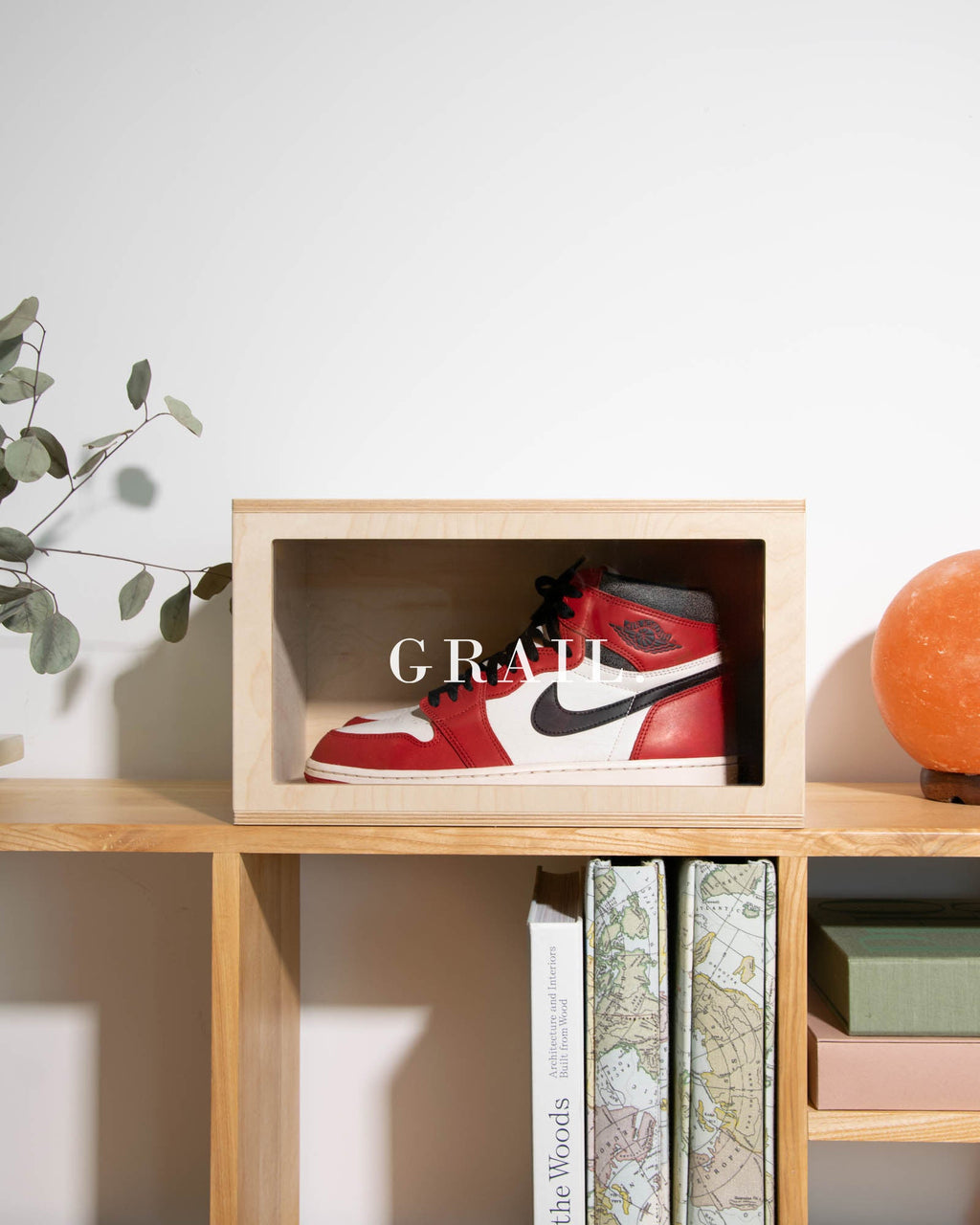 Premium birch plywood shoe box featuring laser-engraved 'GRAIL' text on the plexiglass front panel.